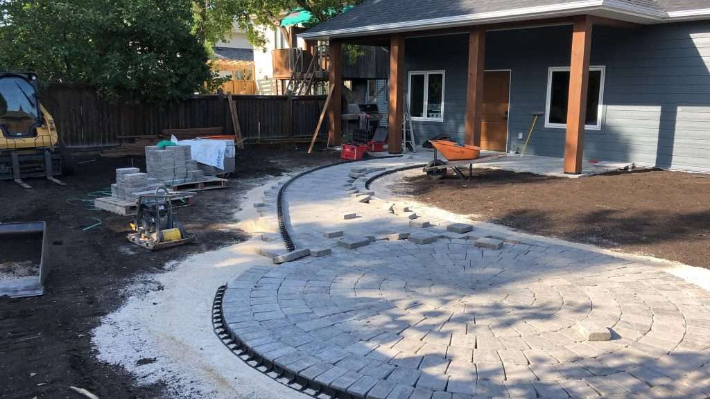 6ea7fa1c-26f6-46a9-b979-f77c0fc56f14 Progress Photo Of Patio And Walkway Made Of Brick Hardscapes | Urban Yard | Landscaping Steinbach